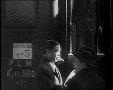 Japanese League of Nations Delegate Walking Past a Train, 1933. Creator: British Pathe Ltd.