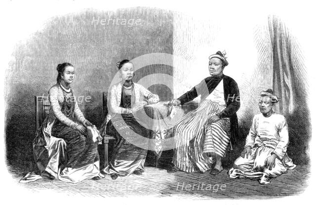 Burmese ladies and gentleman, with an attendant, 1870. Creator: Unknown.