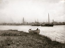 Rowing boat by a canal, Rotterdam, 1898.Artist: James Batkin