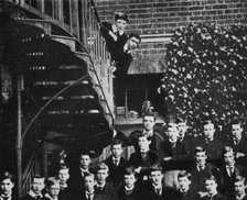 'Winston climbing a staircase, while the class pose', c1889, (1945). Artist: Unknown.