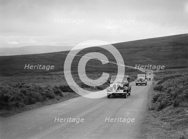 AS Whiddington's Frazer-Nash BMW ahead of RE Wright's Ford V8 at the MCC Torquay Rally, July 1937. Artist: Bill Brunell.