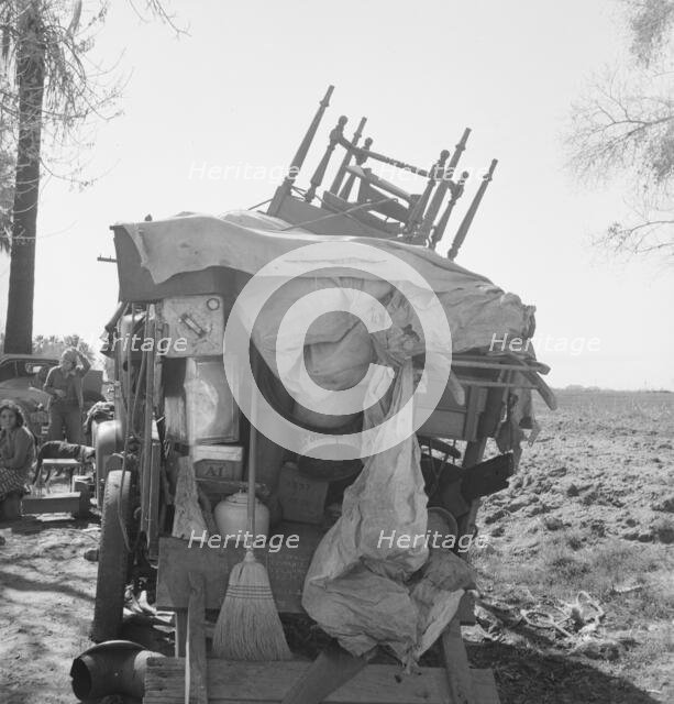 Migrant family outfit on U.S. 99 between Bakersfield, California, and the Ridge, 1939. Creator: Dorothea Lange.