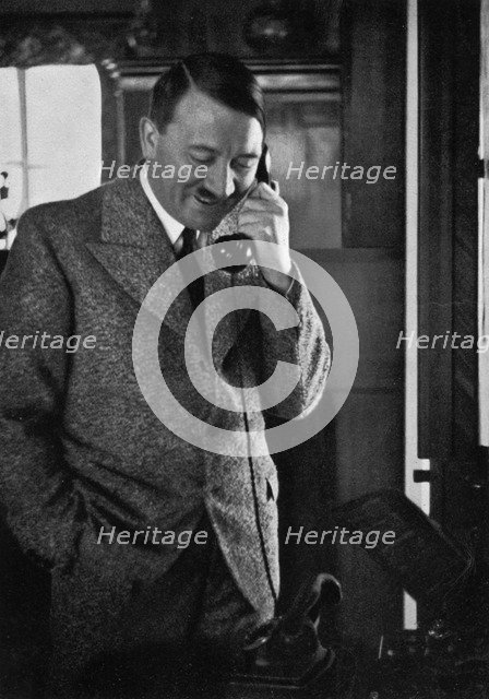 Adolf Hitler on the telephone, January 1935. Artist: Unknown