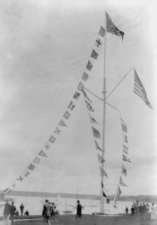 Pole with flags of different countries; sailboats in background, Oyster Bay, Long Island, N.Y., 1905 Creator: Frances Benjamin Johnston.