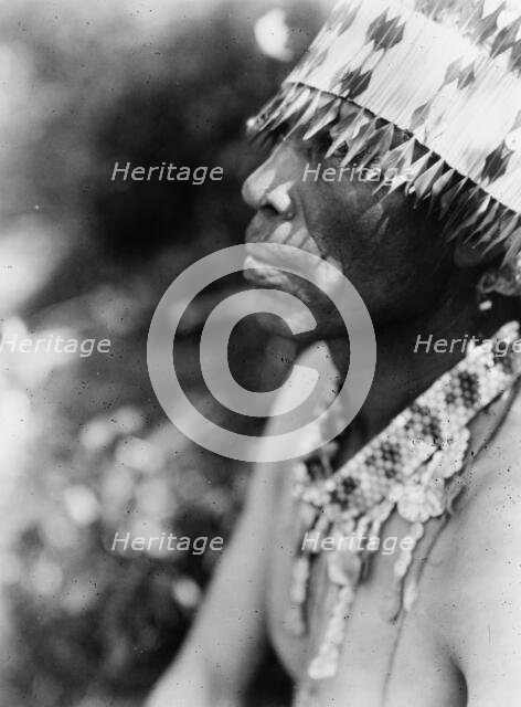 Coast Pomo with feather head-dress, c1924. Creator: Edward Sheriff Curtis.