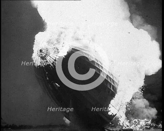 The German Airship, the Hindenburg, its Rear Half Destroyed And Obscured By Smoke With..., 1937. Creator: British Pathe Ltd.