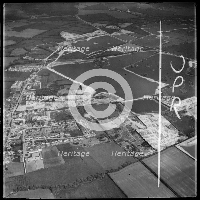 Gravel extraction and new water filled gravel pits, South Cerney, Gloucestershire, 1973. Creator: Aerofilms.