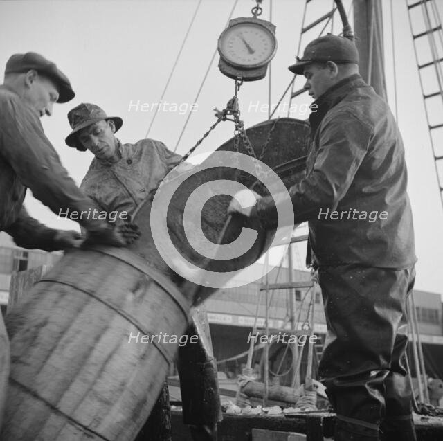 New England fishermen unloading fish at the Fulton fish market, New York, 1943. Creator: Gordon Parks.