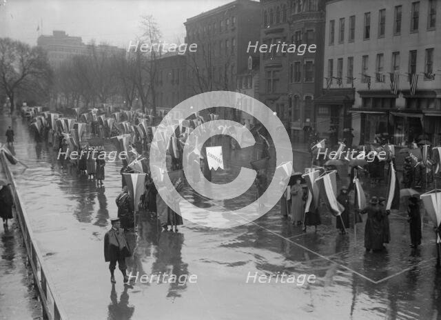 Woman Suffrage - Marching in Rain, 1917. Creator: Harris & Ewing.