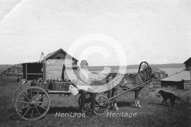 A kumys delivery man at the resort of Lake Shira, 1900-1909. Creator: LI Vonago.