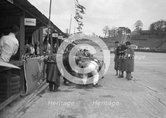 N Black and CW Fiennes' MG C type in the pits at the JCC Double Twelve race, Brooklands, May 1931. Artist: Bill Brunell.