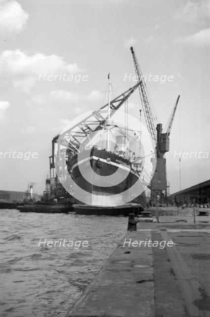 A ship moored in London docks, 1937. Artist: SW Rawlings