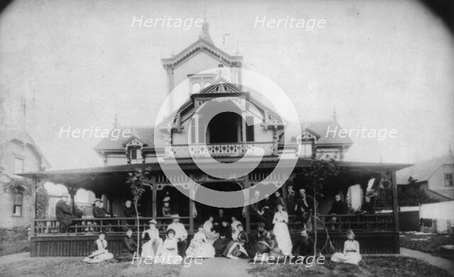 27 men and women (Johnston family) in front of beach house "Dartmouth", c1880. Creator: Unknown.