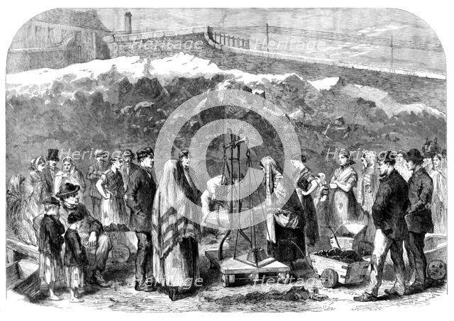 The Cotton Famine: distributing coal at the Castle-field old coal-wharf, Manchester, 1862. Creator: Unknown.