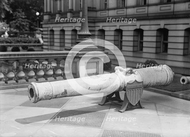 Medals, Decorations, Etc. - Spanish Gun at War Department Made Into Medals, 1917. Creator: Harris & Ewing.