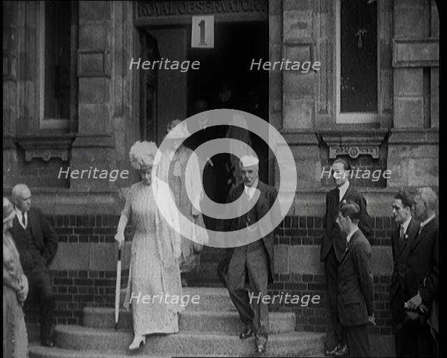 Queen Mary Accompanied by a Group of Officials Emerging from a Building , 1924. Creator: British Pathe Ltd.