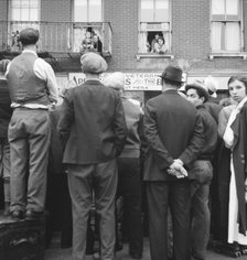 Crowds around post office, Lower East Side, New York, 1936. Creator: Dorothea Lange.