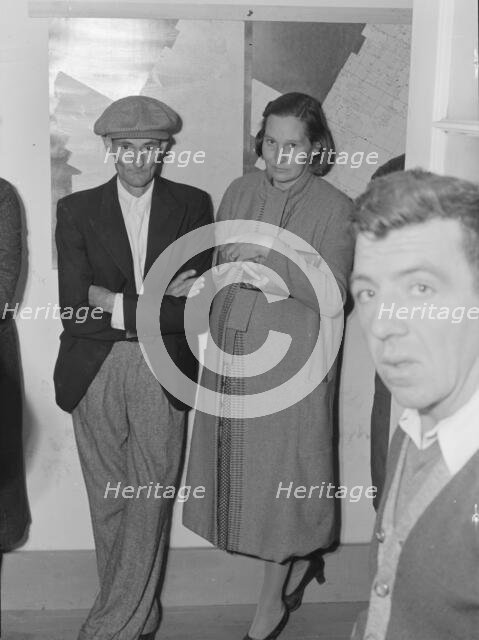 Night meeting in the FSA office, Visalia, Tulare County, California, 1938. Creator: Dorothea Lange.