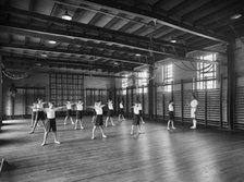 Physical Education in the gymnasium, Merchant Taylors School, Northwood, Hertfordshire, 1933-1939 Artist: Marshall Keene and Company.
