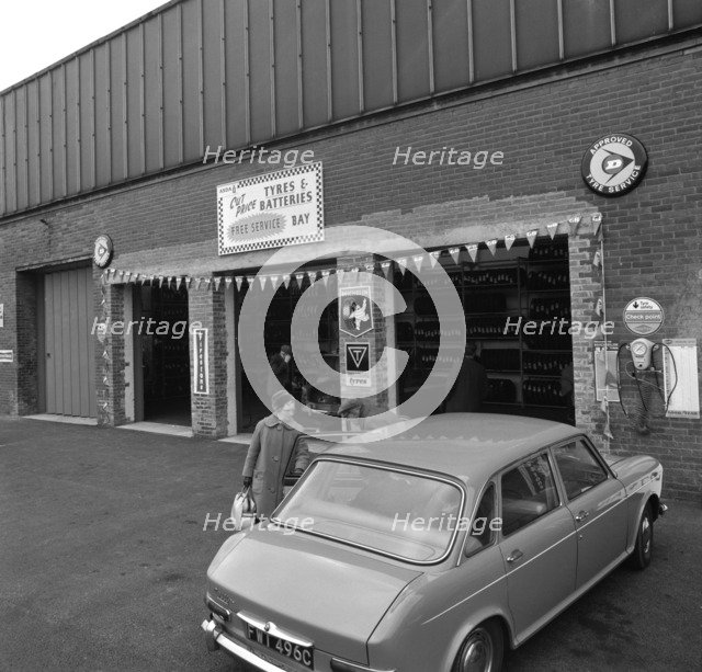 Mk 1 BMC Austin 1800 outside a tyre fitting bay in Rotherham, South Yorkshire, 1969. Artist: Michael Walters