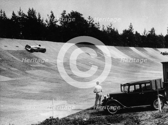 John Cobb's Napier Railton on the banking, Brooklands, Surrey, c1933-c1935. Artist: Unknown