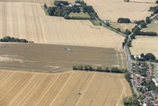 A two seat Spitfire in flight near Goodwood Aerodrome, West Sussex, 2020. Creator: Damian Grady.