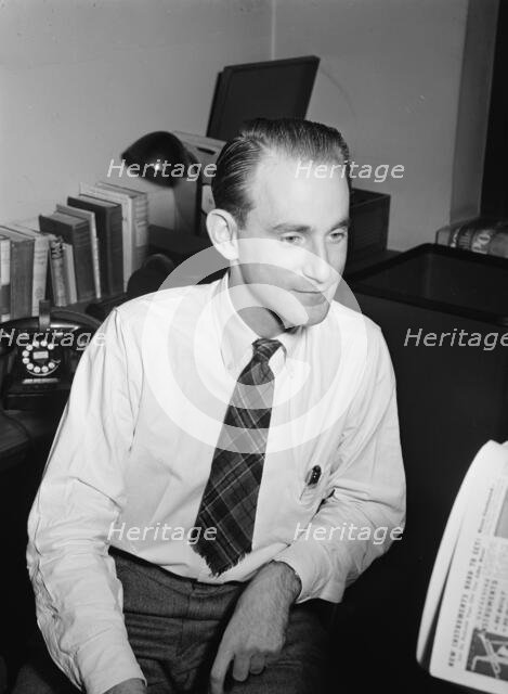 Portrait of Mike Levin, Down Beat office, New York, N.Y., 1946. Creator: William Paul Gottlieb.