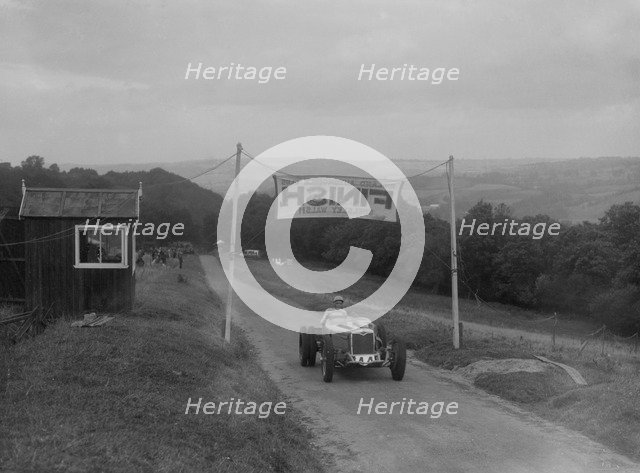 Riley finishing the Shelsley Walsh Hillclimb, Worcestershire, 1935. Artist: Bill Brunell.