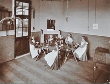 Girls knitting socks by machine at the Elm Lodge School for Blind Girls, London, 1908. Artist: Unknown.