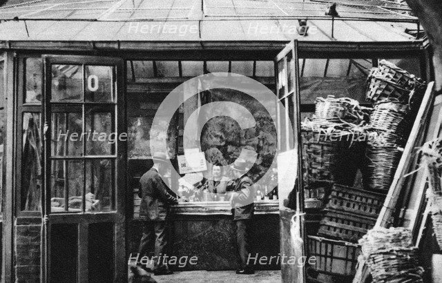 A bar in the Central Market quarter, Paris, 1931.Artist: Ernest Flammarion