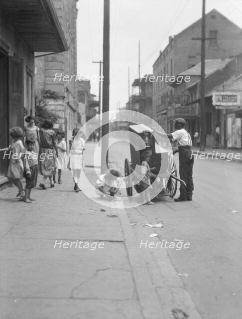 Organ grinder, New Orleans, between 1920 and 1926. Creator: Arnold Genthe.