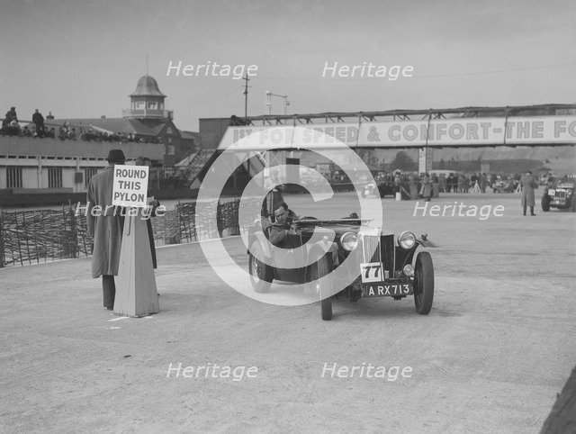 MG TA competing in the JCC Rally, Brooklands, Surrey, 1939. Artist: Bill Brunell.