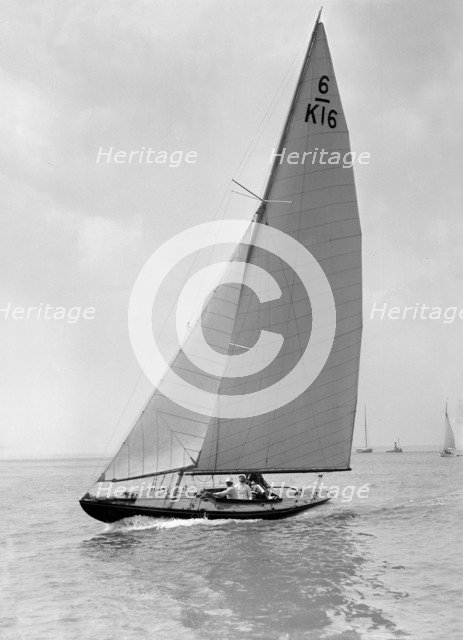 The 6 Metre 'Jean' (K16) sailing upwind, 1922. Creator: Kirk & Sons of Cowes.