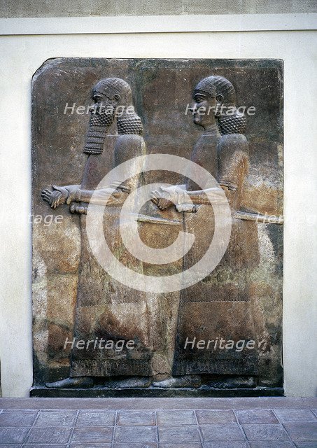 Assyrian relief of two servants, Palace of Sargon II, Khorsabad, c8th century BC. Artist: Unknown