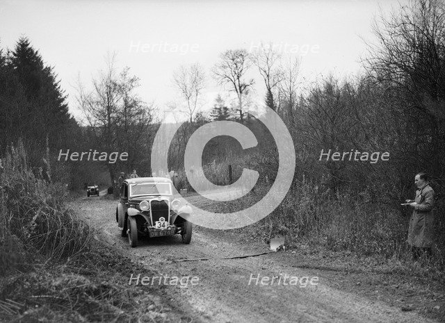 1935 Singer 9 fixed-head coupe competing in the Great West Motor Club Thatcher Trophy, 1938. Artist: Bill Brunell.