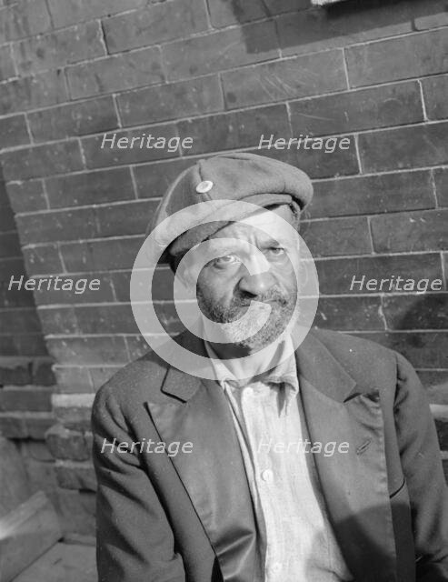 An old peanut vendor on Seaton Road, Washington, D.C., 1942. Creator: Gordon Parks.