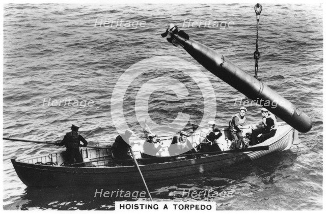 Hoisting a torpedo, HMS 'Courageous', 1937. Artist: Unknown