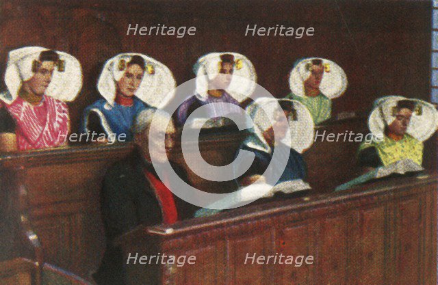 Dutch women wearing traditional dress in church, c1928. Creator: Unknown.