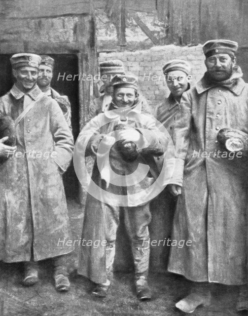 German prisoners of war with their ration of bread, 1915. Artist: Unknown