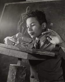 Boy sculpting, Harlem Art Center, 1939. Creator: Berenice Abbott.