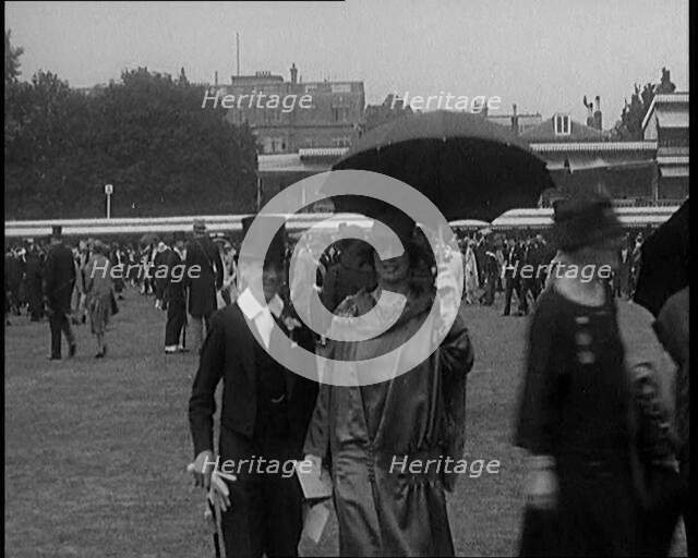 A Group of Civilians Dressed Glamorously Walking on the Grounds of a Cricket Match, 1920. Creator: British Pathe Ltd.