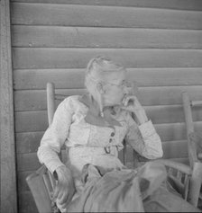 Southern lady of the old school on the veranda...of the Wray Plantation, Georgia, 1937. Creator: Dorothea Lange.