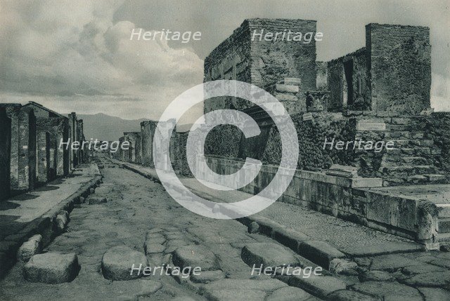 Street between ruins, Pompeii, Italy, 1927. Creator: Eugen Poppel.
