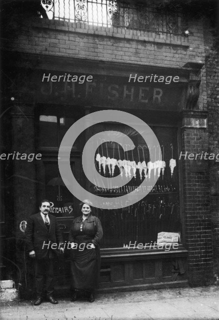 Polish Jews outside their umbrella shop in Hackney, London, c1910. Artist: Unknown