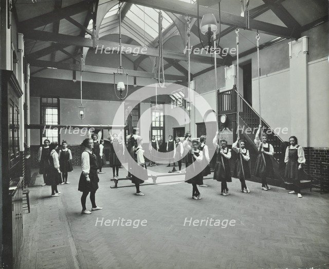 Girls in the gymnasium, Fulham County Secondary School, London, 1908. Artist: Unknown.