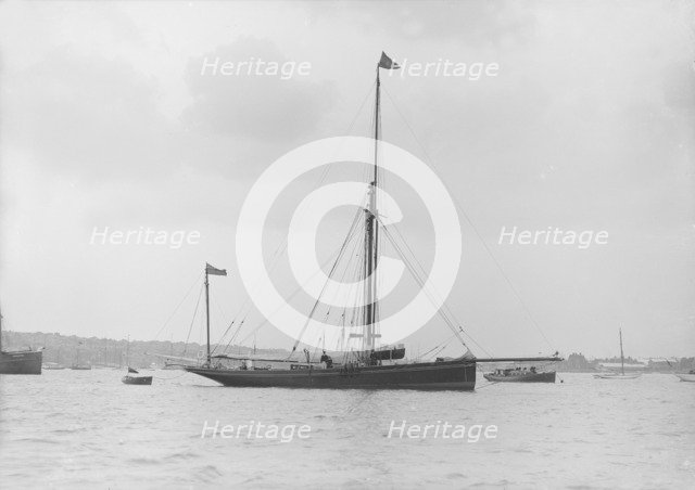 The 40 ton yawl 'Hyacinth' at anchor, 1913. Creator: Kirk & Sons of Cowes.