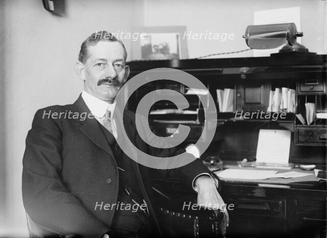 Robt. N. Page seated at desk, 1916. Creator: Bain News Service.