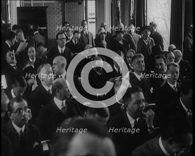 A Large Group of Male and Female Delegates from the League of Nations Sitting in a Room, 1924. Creator: British Pathe Ltd.