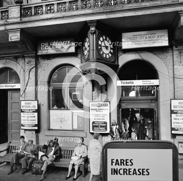 Passengers waiting outside the ticket office, Charing Cross Station, London, 1970. Artist: John Gay