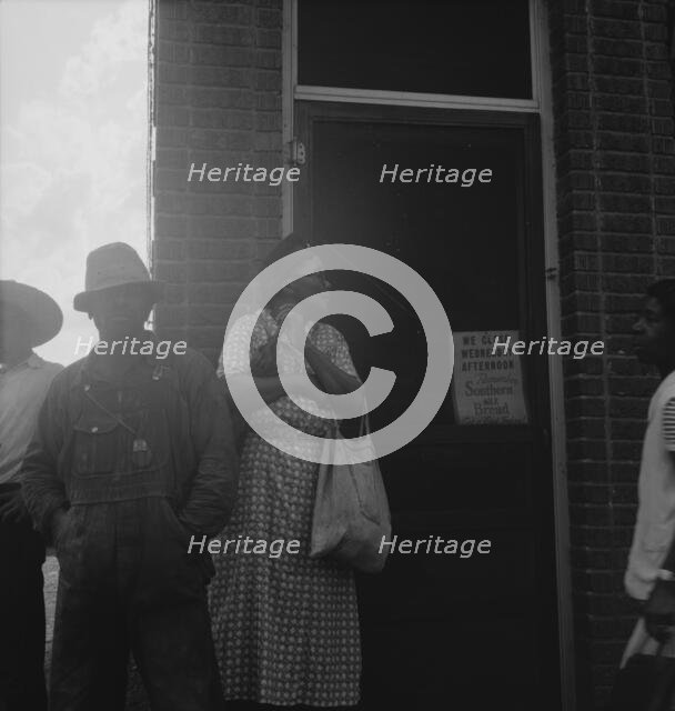 Untitled, 1935-1942. [African-Americans outside a shop]. Creator: Unknown.